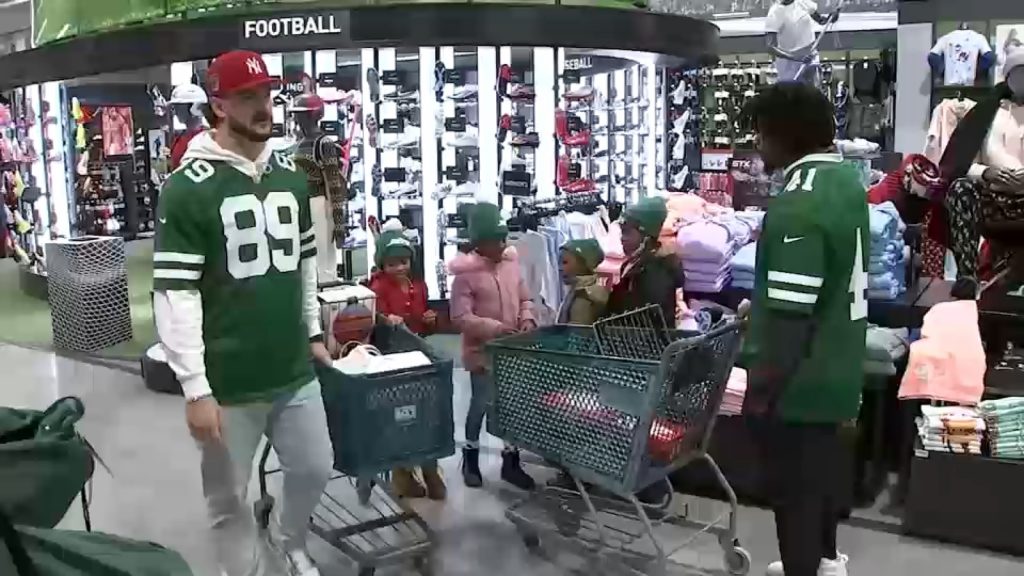 Jets players throw holiday shopping spree for kids at Dick's Sporting Goods in East Hanover, NJ