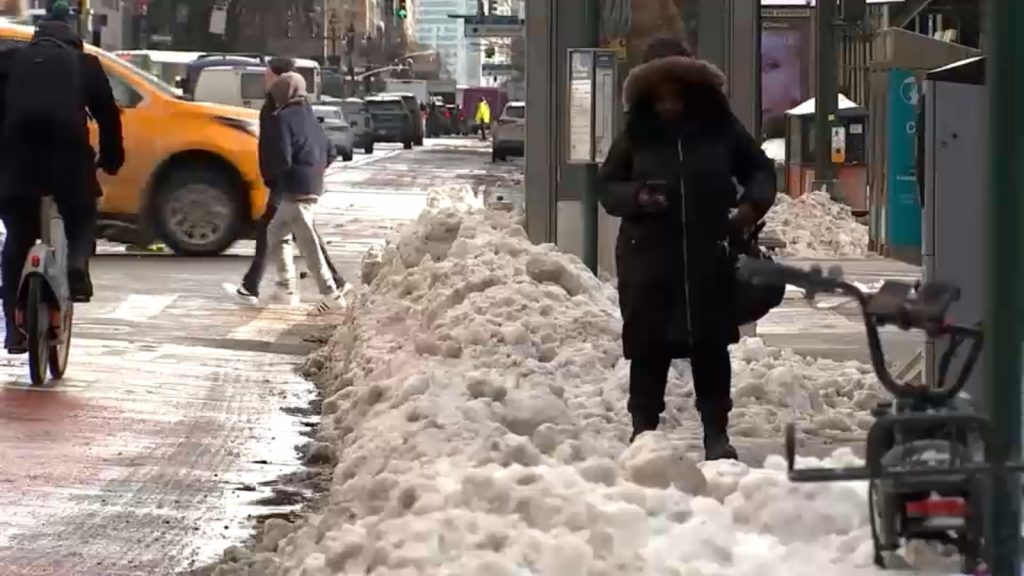 New York City Department of Sanitation melts snow to improve accessibility for strollers, wheelchairs, carts, pedestrians, drivers