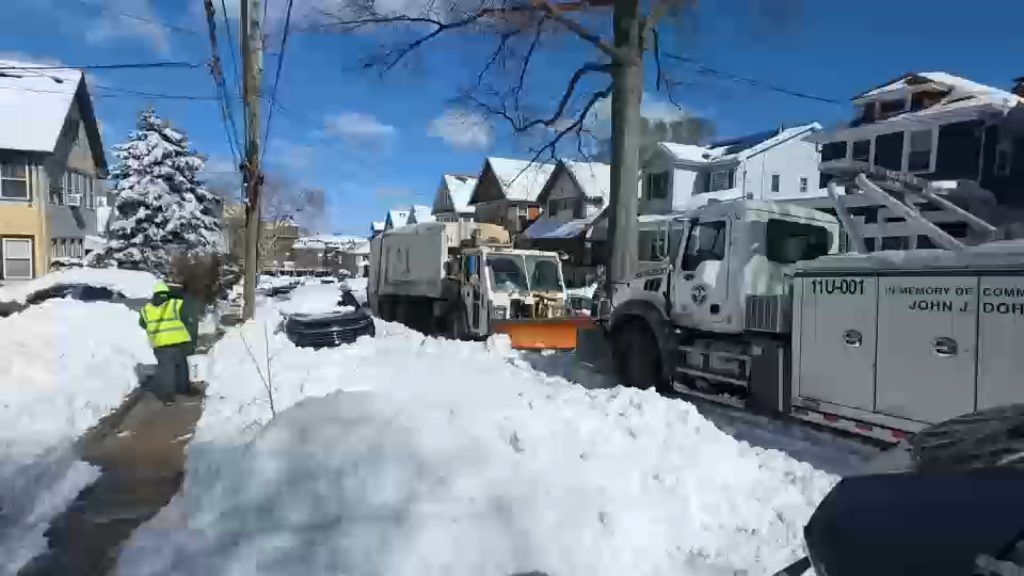 NYC sanitation crews struggling to dig out Staten Island following winter blizzard; school attendance low Tuesday