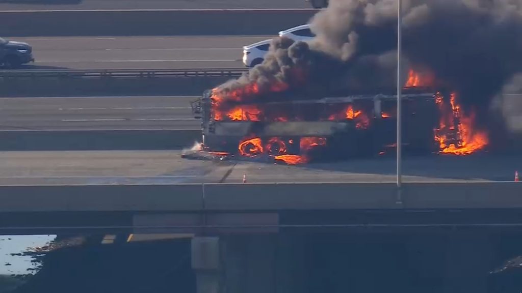 NJ Transit bus on fire on Turnpike near Newark Airport after tire blowout; crews working to put out flames