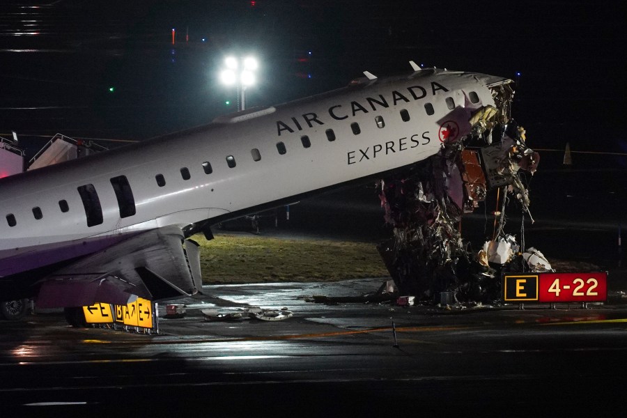 Pilot and copilot killed in collision between jet and fire truck at New York's LaGuardia Airport Pilot and copilot killed in collision between jet and fire truck at New York's LaGuardia Airport
