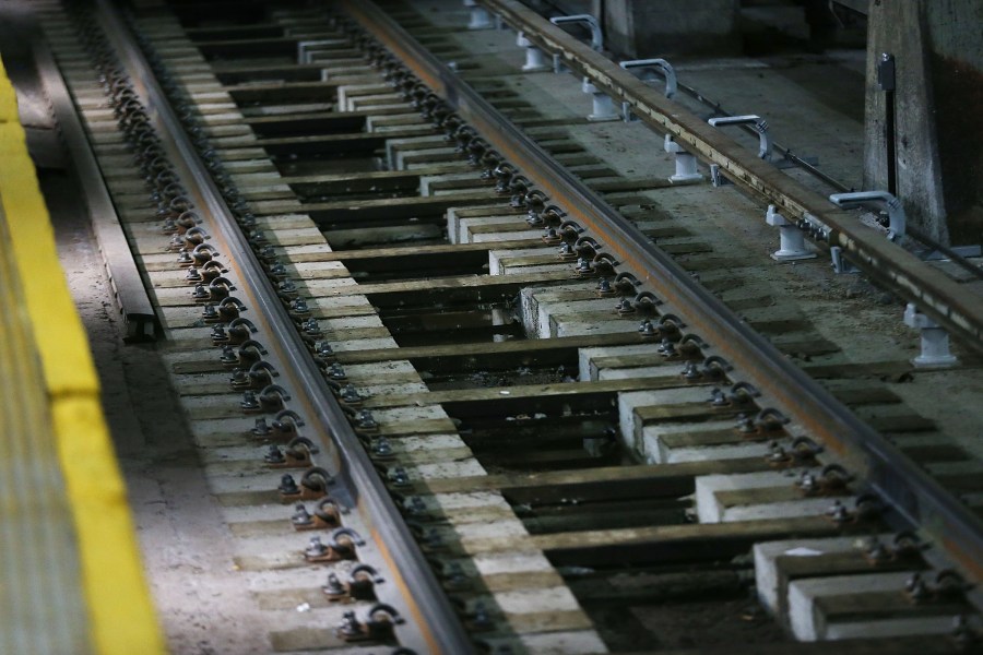 Woman, 82, fractures spine after being pushed onto train tracks: officials Woman, 82, fractures spine after being pushed onto train tracks: officials