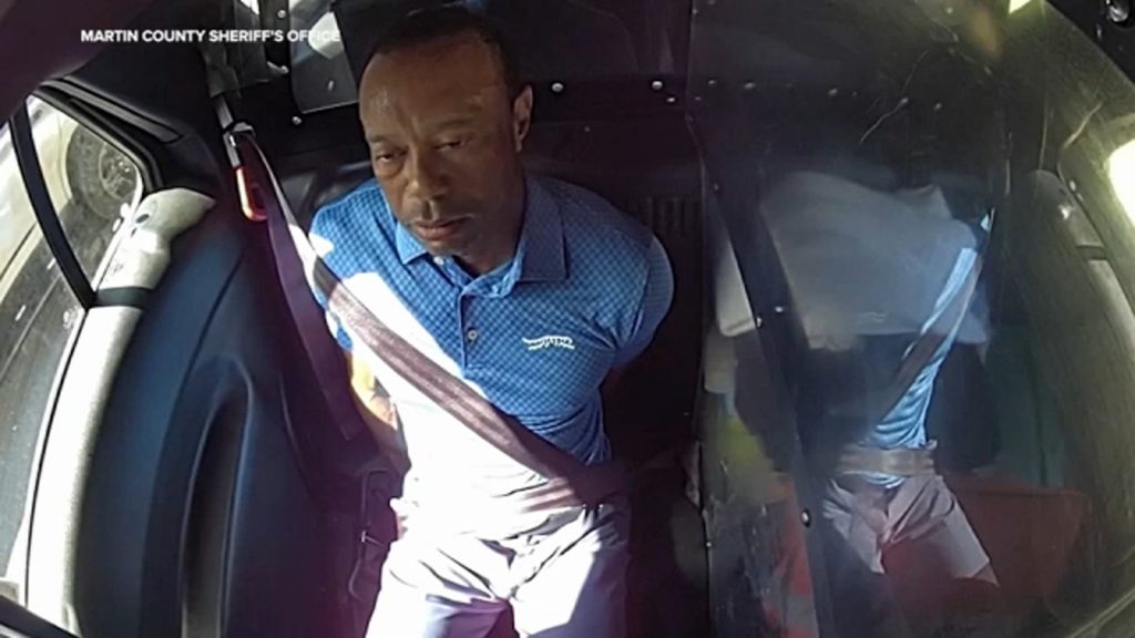 Bodycam shows a stunned Tiger Woods handcuffed after a Florida rollover crash
