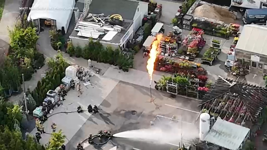 Flames shoot into the air from propane tank at greenery in Bellmore