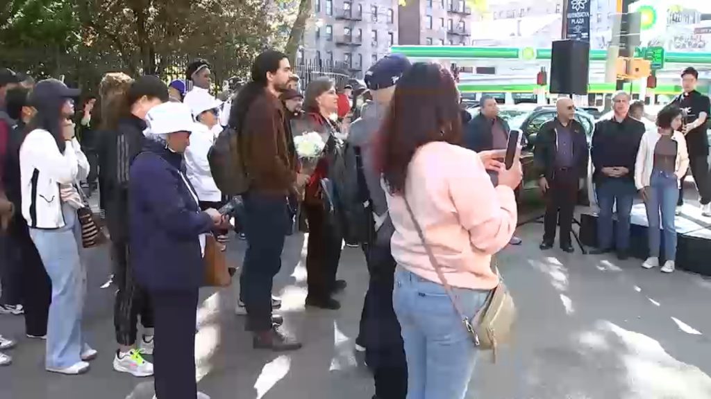 Inwood community holds vigil for 3 victims killed in apartment building fire