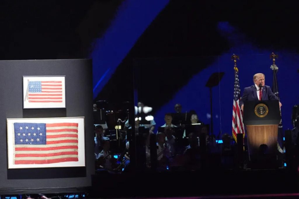 Trump has one of the country's first flags on stage, dating from 1777, during Fourth of July speech
